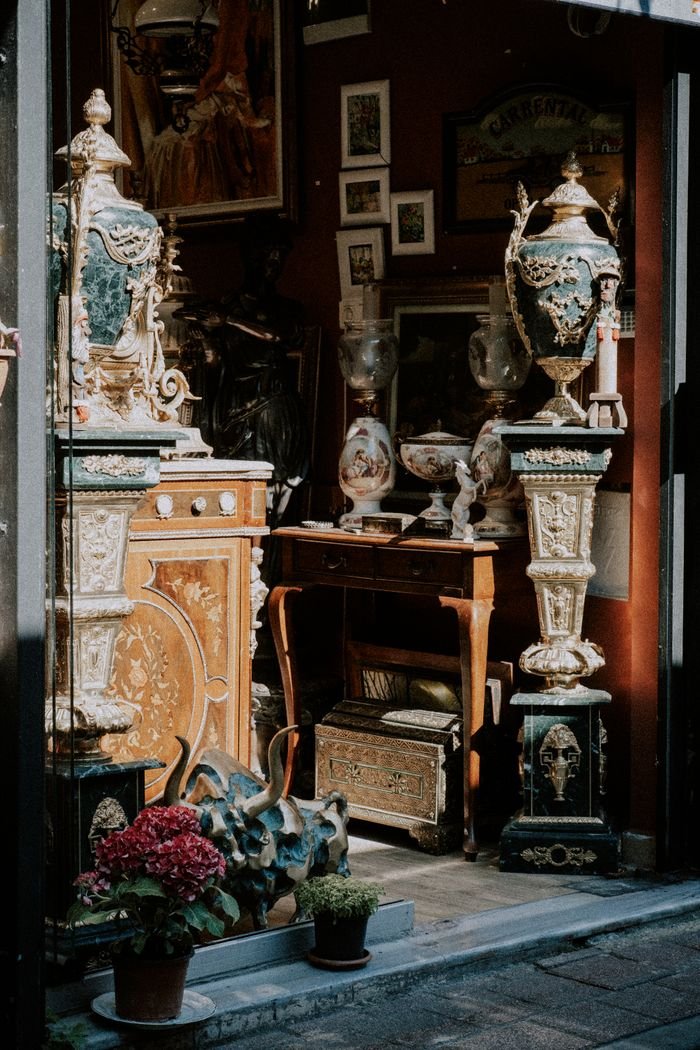 hero-img Explore a quaint antique shop showcasing ornate vases and vintage decor in a cozy setting.